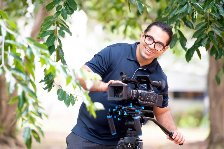 Arts degree student with film equipment