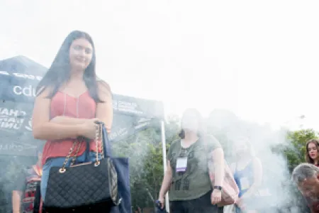 CDU student Eva-Marie Marshall observes a traditional smoking ceremony as O Week begins